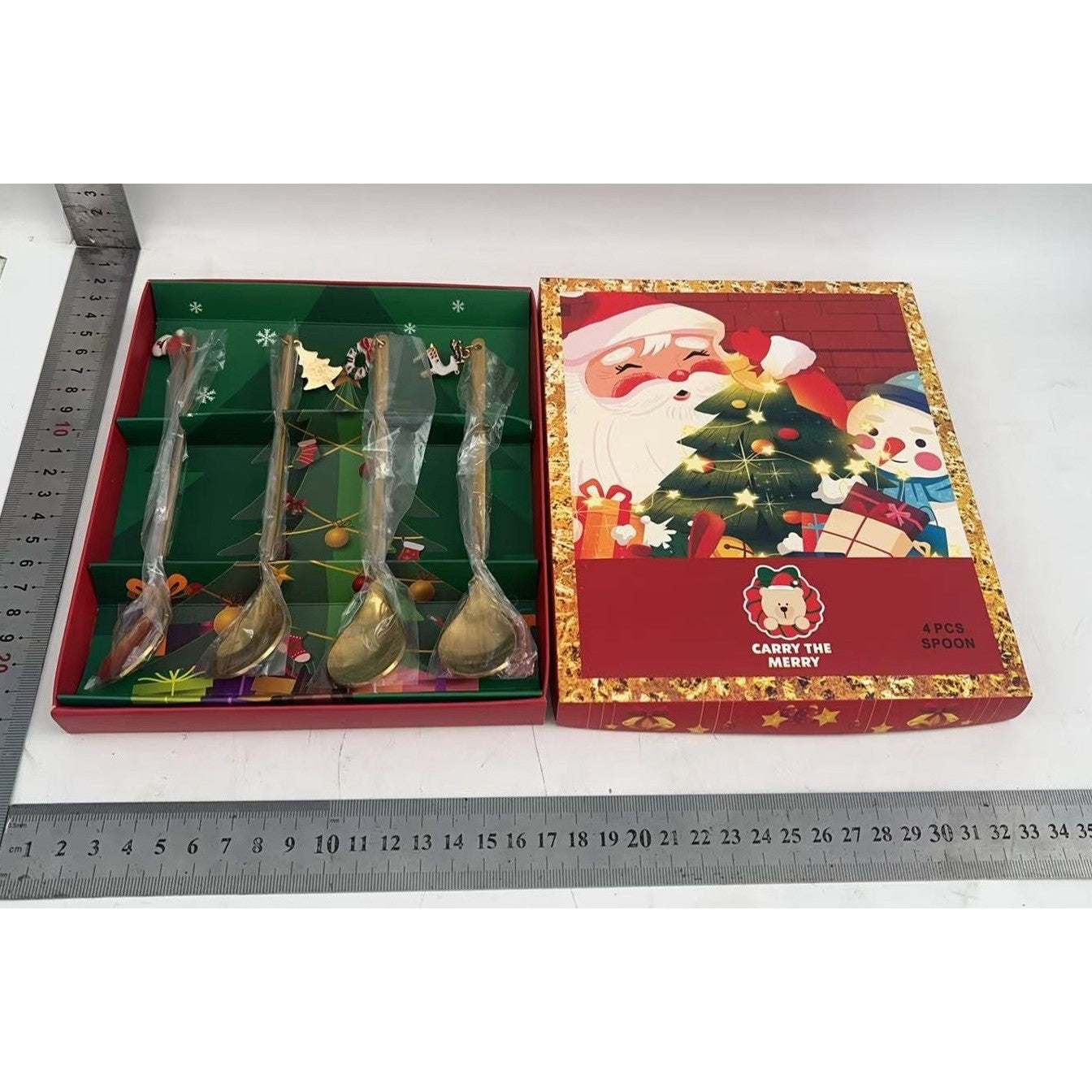 Set 4 Lingurite, Tema Craciun, Model Carry The Merry, 4 Modele Tip Pandantiv, din Otel Inoxidabil, 19 x 16 x 2 cm, Multicolor