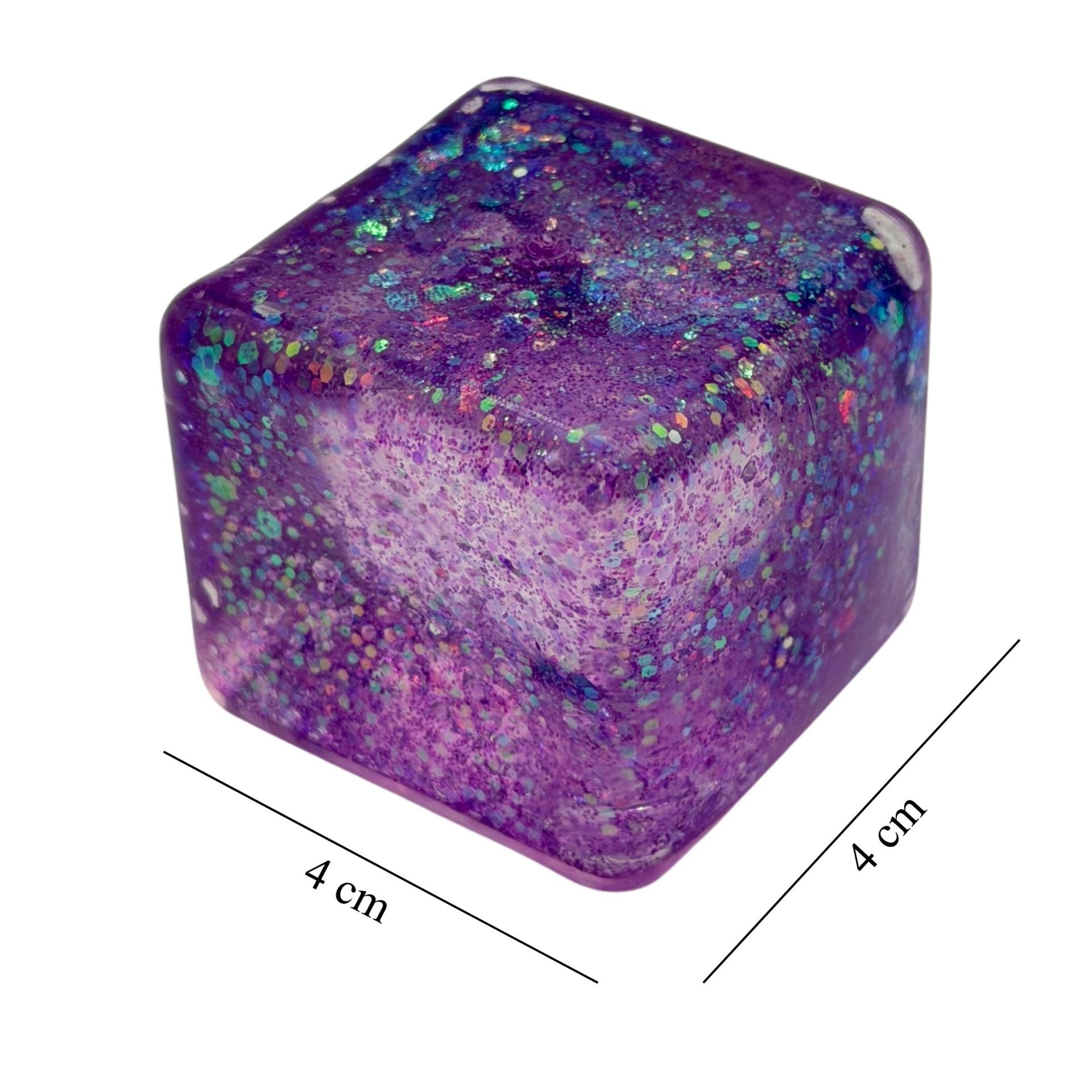 Jucarie Squishy tip Needoh in Forma de Cub, Model Ice Cube cu Sclipici Magic, Antistres Senzoriala Comprimabila cu Revenire Lenta, 3x3 cm, 30 g, Mov