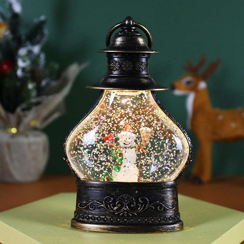 Decoratiune de Craciun tip Felinar, Glob de Cristal cu Fulgi de Zapada, Model Om de Zapada, Ornamentat cu Luminite Interioare, 14.5 x 9 x 3 cm, Rama Neagra, Transparent