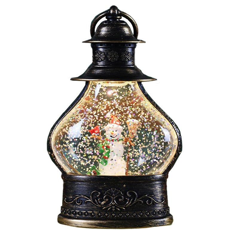 Decoratiune de Craciun tip Felinar, Glob de Cristal cu Fulgi de Zapada, Model Om de Zapada, Ornamentat cu Luminite Interioare, 14.5 x 9 x 3 cm, Rama Neagra, Transparent
