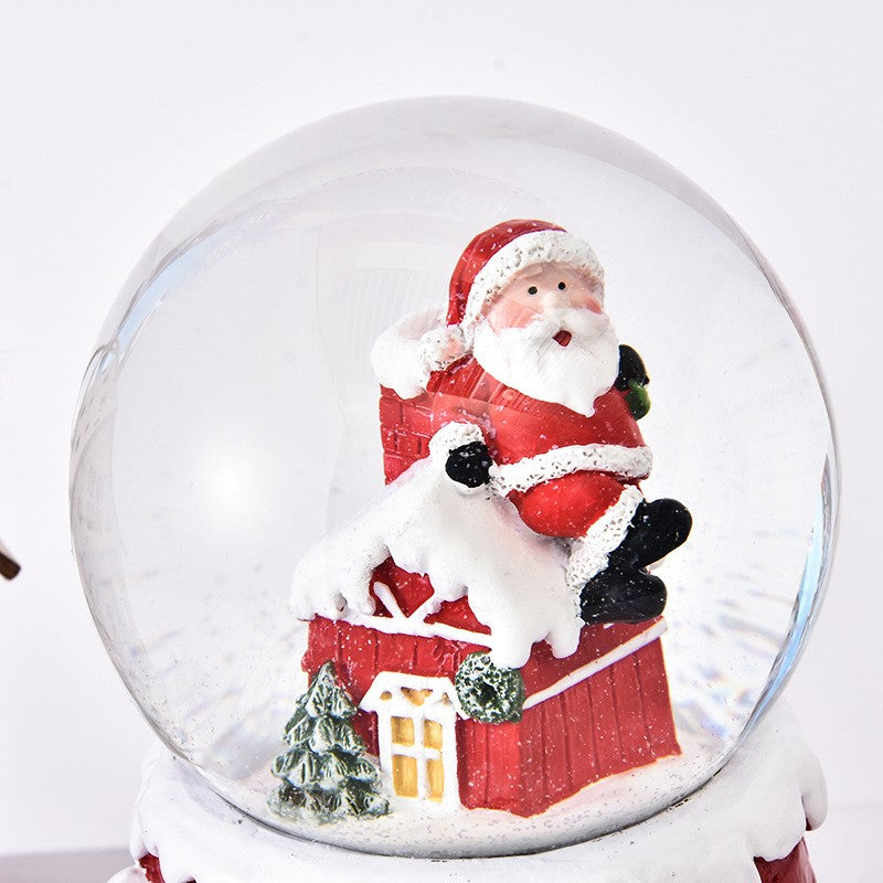 Decoratiune glob cu zapada Mos Craciun pe casa, model 2, diametru 6.5 cm, multicolor