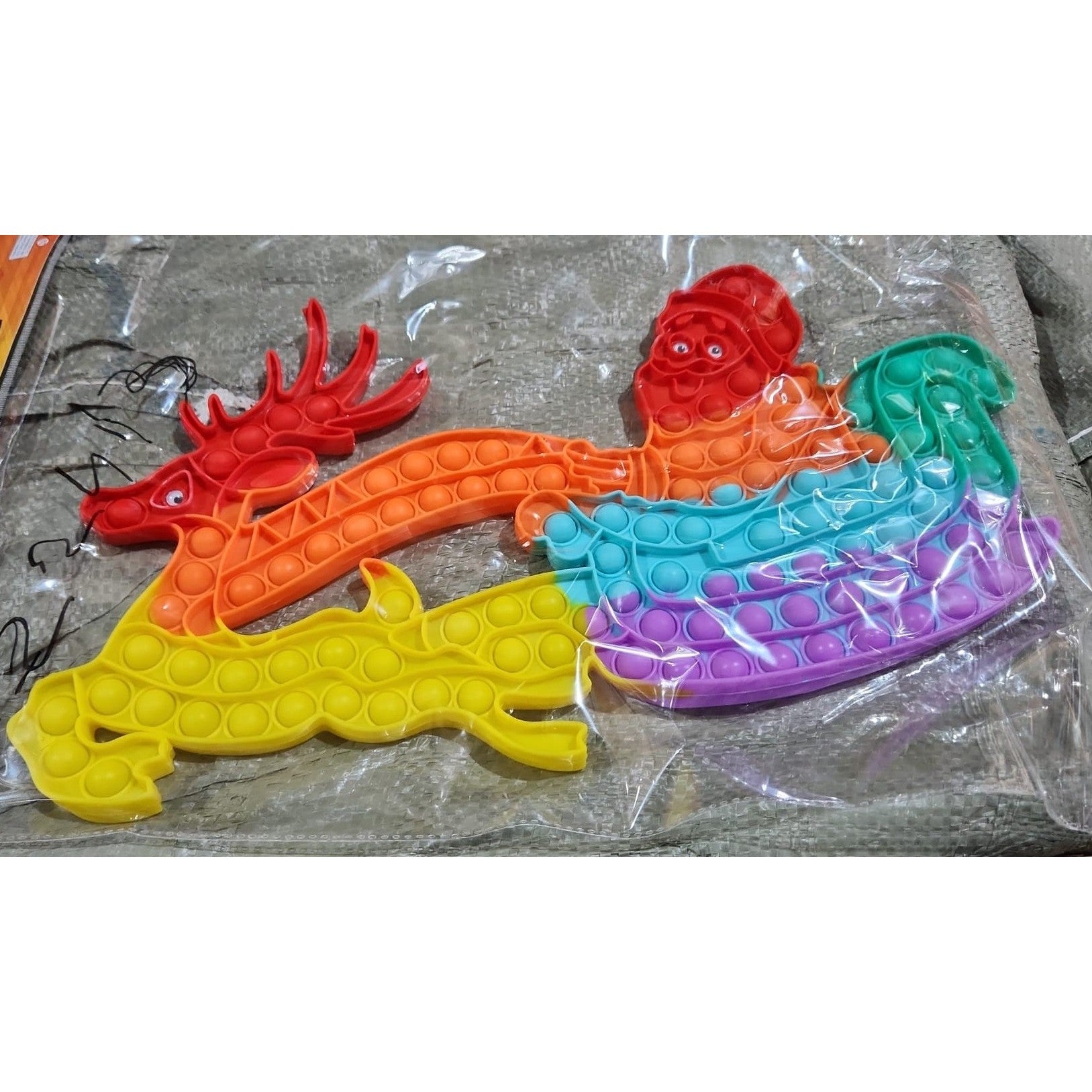 Jucarie Antistres, Tip Pop It Now and Flip It, Sania Lui Mos Craciun cu Renul, 42 x 21 cm, Multicolor