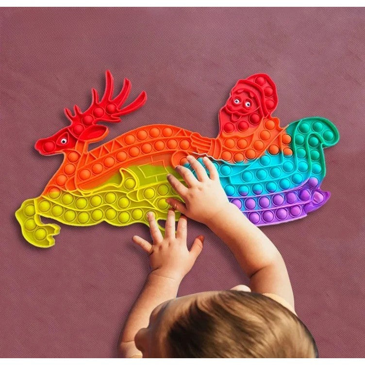 Jucarie Antistres, Tip Pop It Now and Flip It, Sania Lui Mos Craciun cu Renul, 42 x 21 cm, Multicolor
