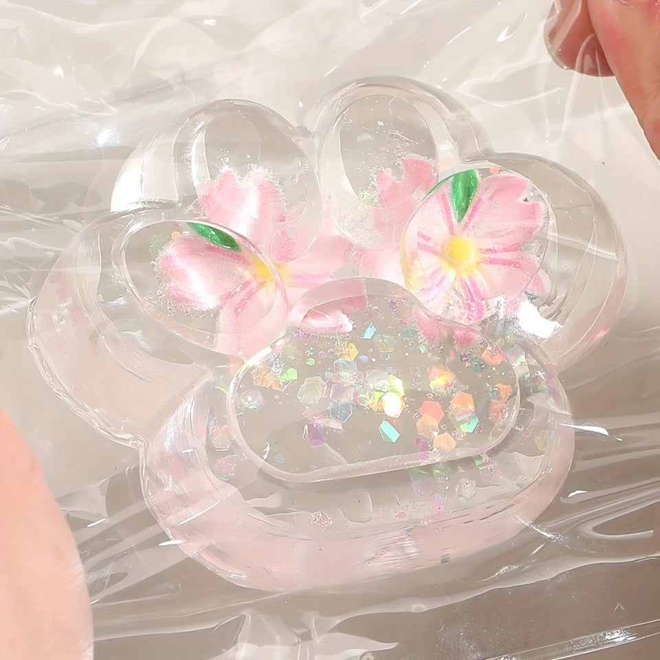 Jucarie Antistres Squishy, Labuta de Pisica Pufoasa, cu Revenire Lenta, 7 x 6.5 cm, Model Flori 2, Transparent