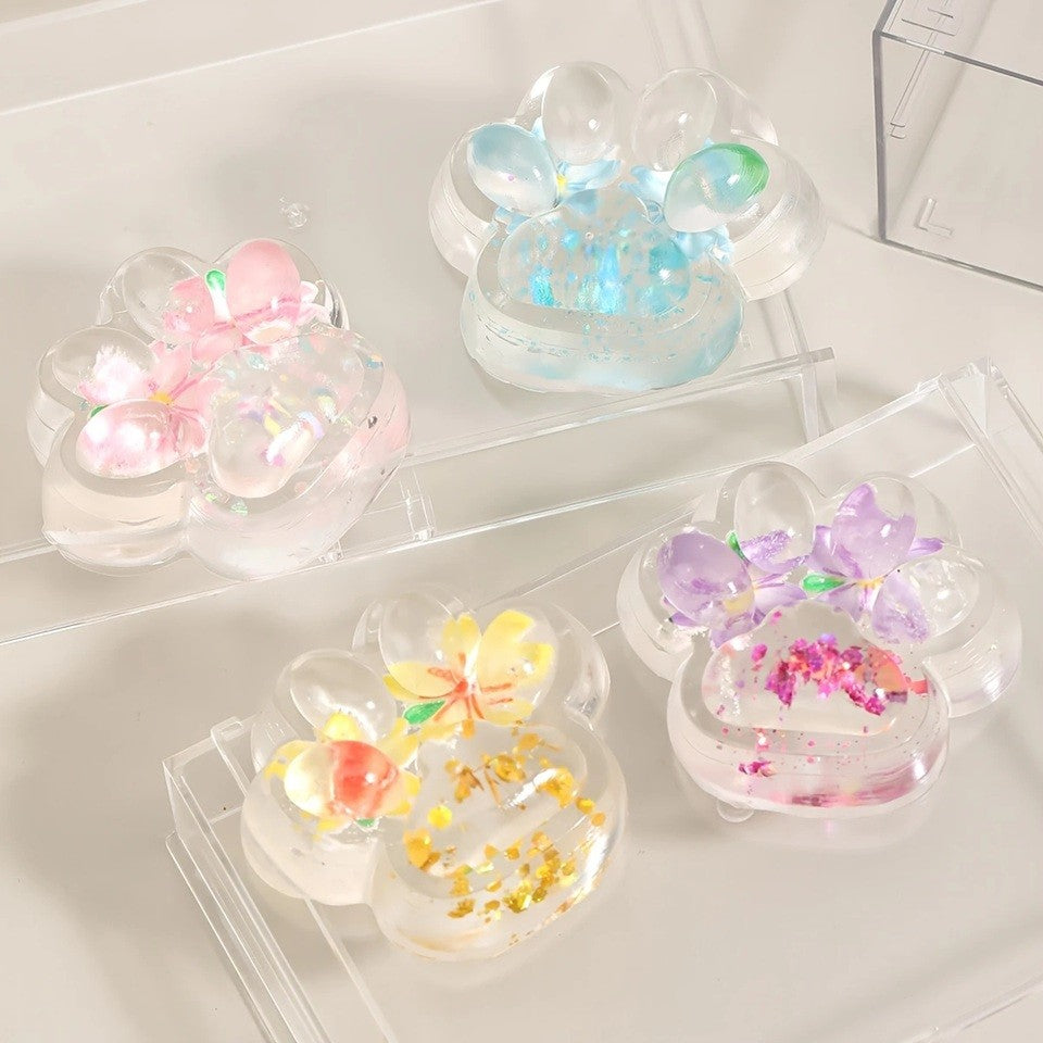 Jucarie Antistres Squishy, Labuta de Pisica Pufoasa, cu Revenire Lenta, 7 x 6.5 cm, Model Flori 2, Transparent