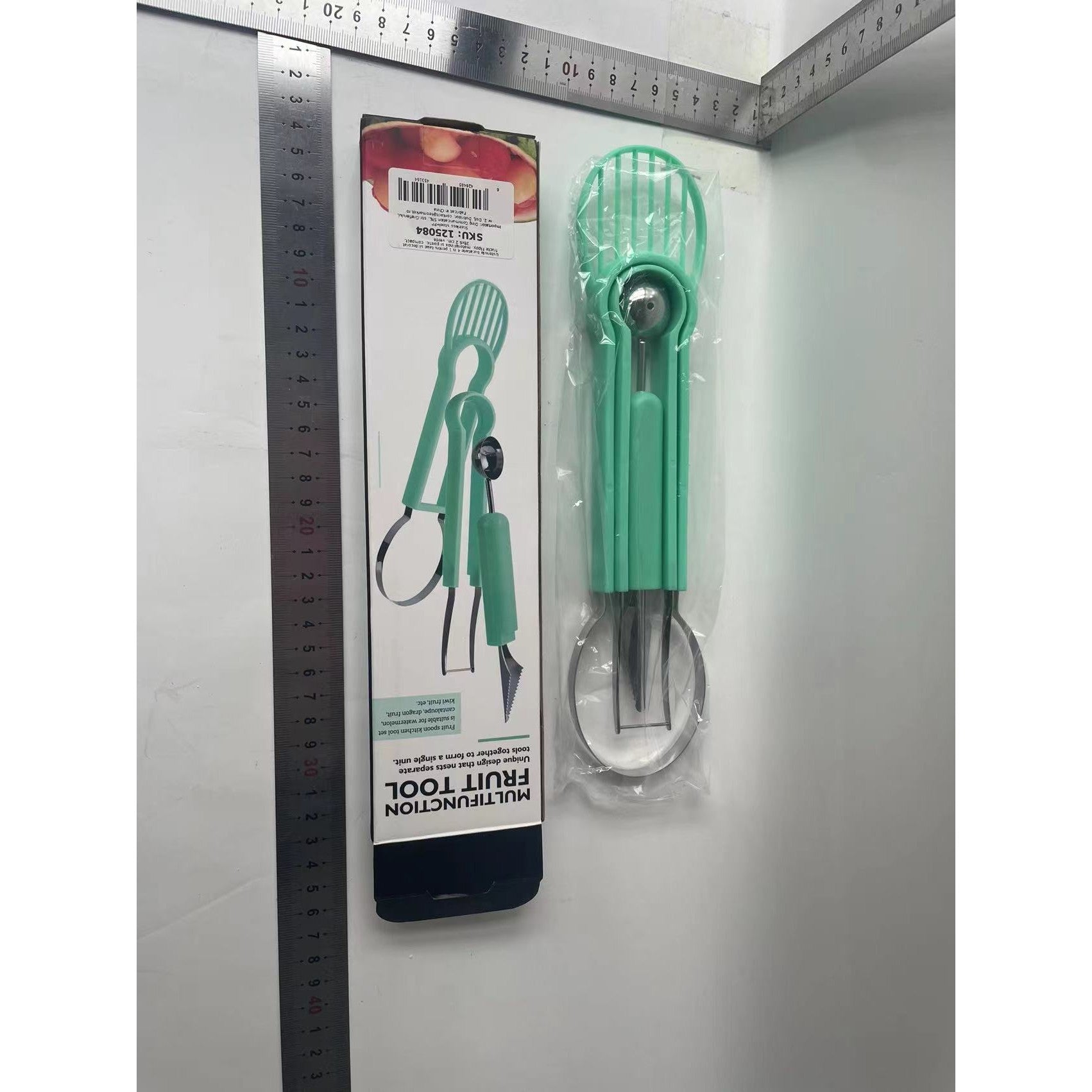 Ustensila bucatarie 4 in 1 pentru taiat si decorat fructe material inox si plastic, compact, 28x6.2 cm, verde